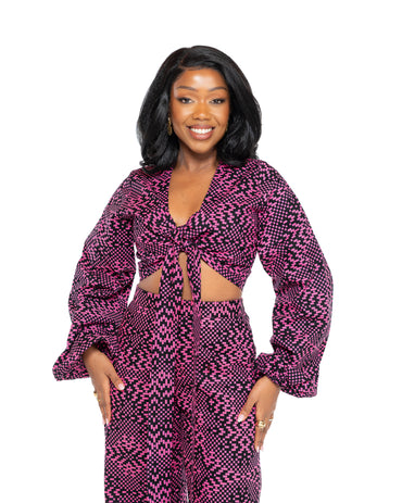 Pink and black Ankara African print wide-leg pants with high waist, bold wax print fabric, women’s stylish trousers Kenya.