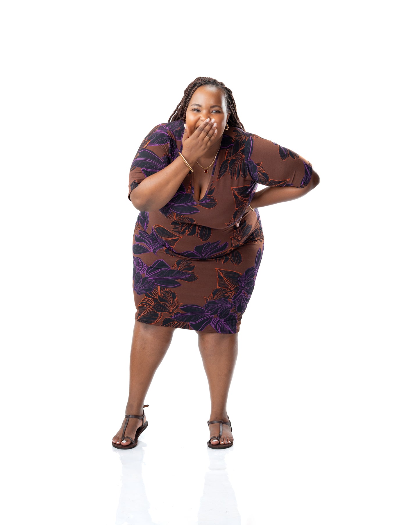 Brown printed bodycon dress with purple floral design, knee-length fitted dress with short sleeves for women in Kenya.