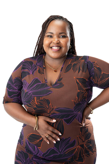 Brown printed bodycon dress with purple floral design, knee-length fitted dress with short sleeves for women in Kenya.