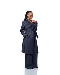 Women’s dark wash denim trench coat with belted waist and longline cut, stylish outerwear fashion Kenya.