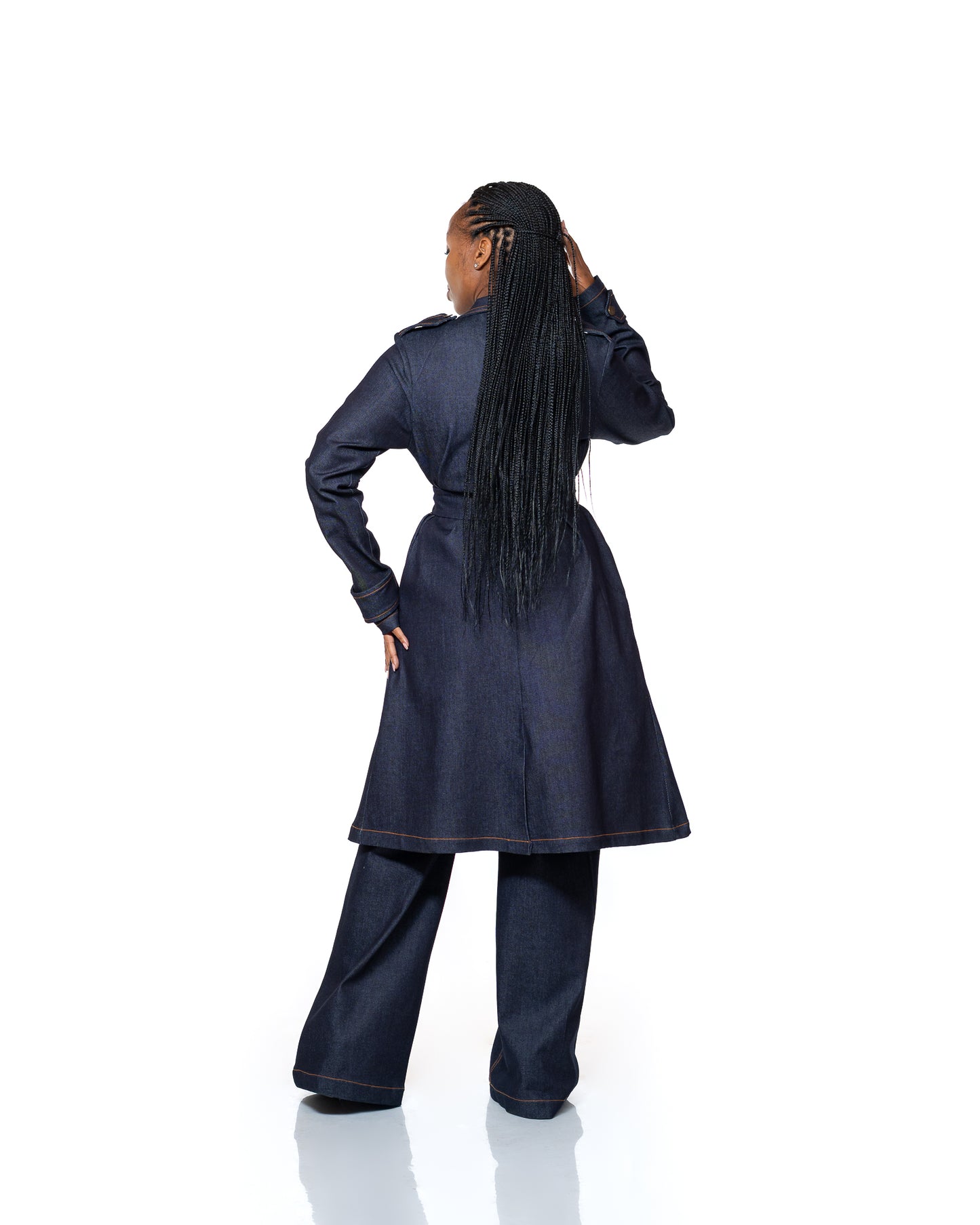 Women’s dark wash denim trench coat with belted waist and longline cut, stylish outerwear fashion Kenya.