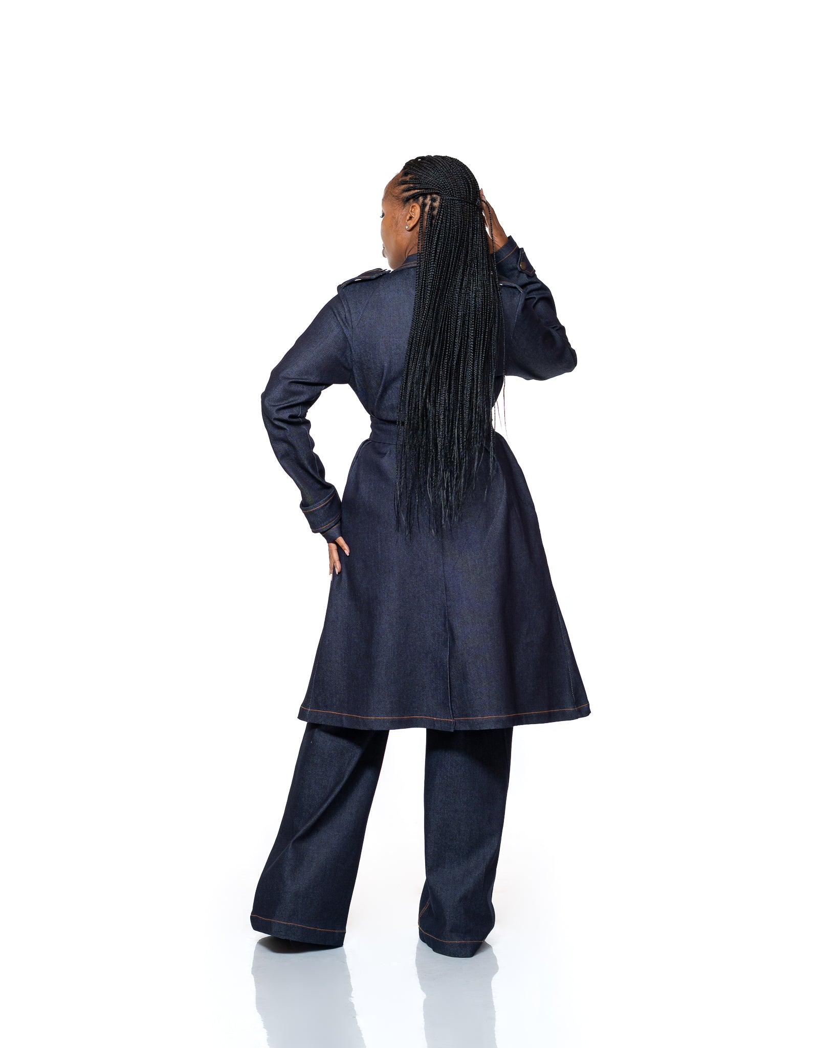Women’s dark wash denim trench coat with belted waist and longline cut, stylish outerwear fashion Kenya.