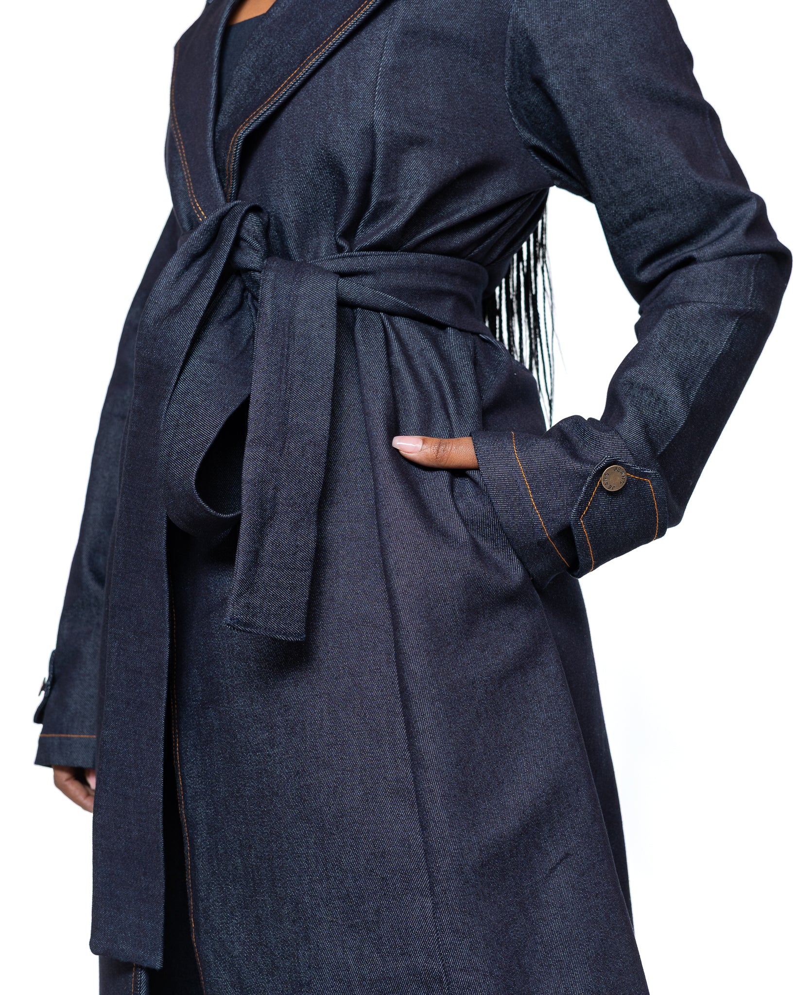 Women’s dark wash denim trench coat with belted waist and longline cut, stylish outerwear fashion Kenya.
