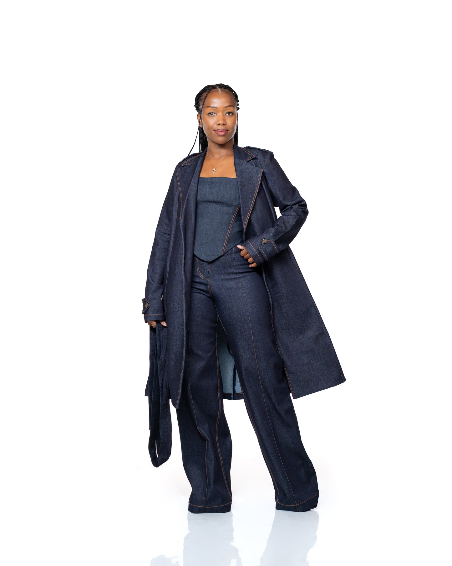 Women’s dark wash denim trench coat with belted waist and longline cut, stylish outerwear fashion Kenya.