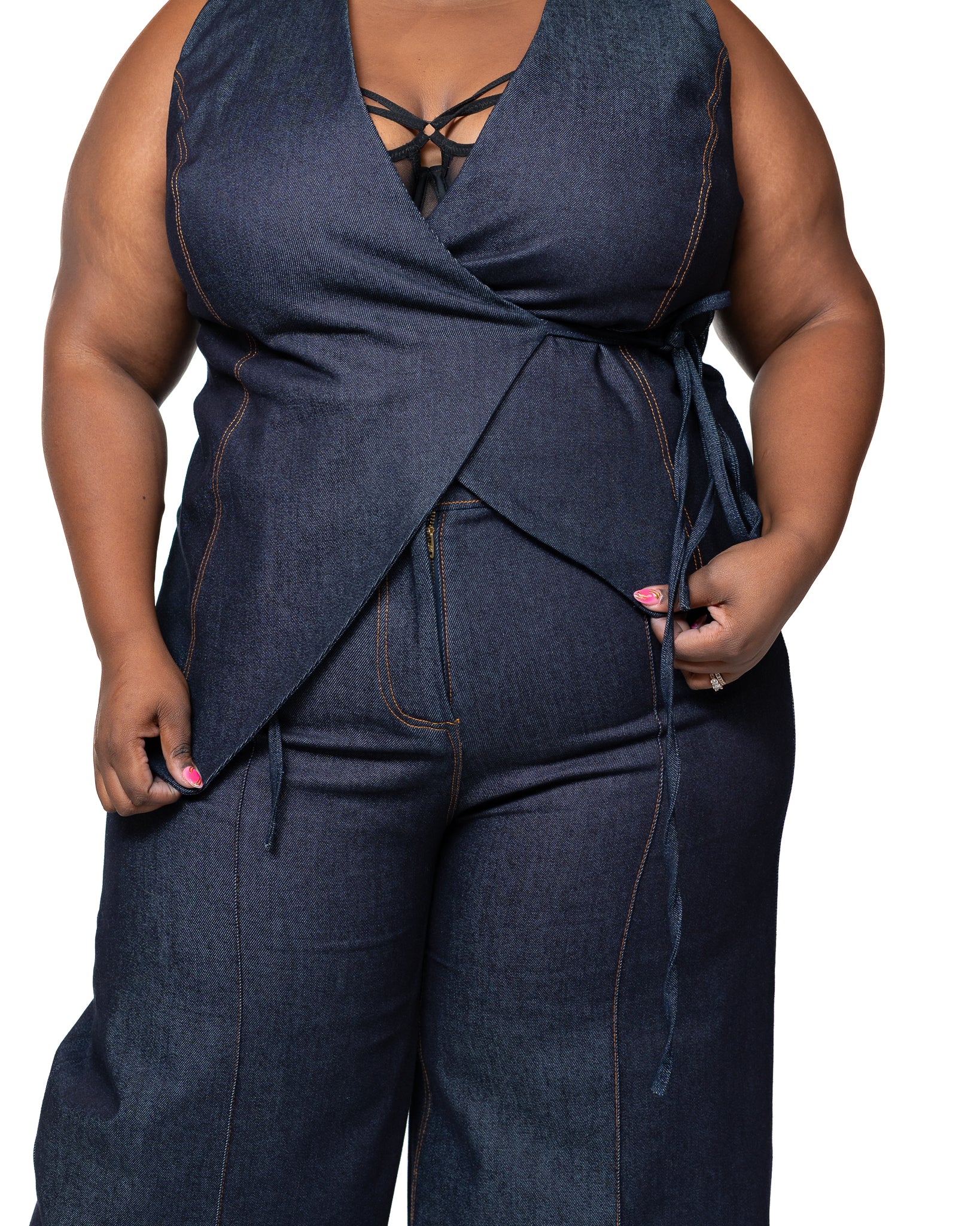 Denim sleeveless wrap top with dark wash finish, deep V-neckline, and side tie, women’s stylish denim blouse Kenya.
