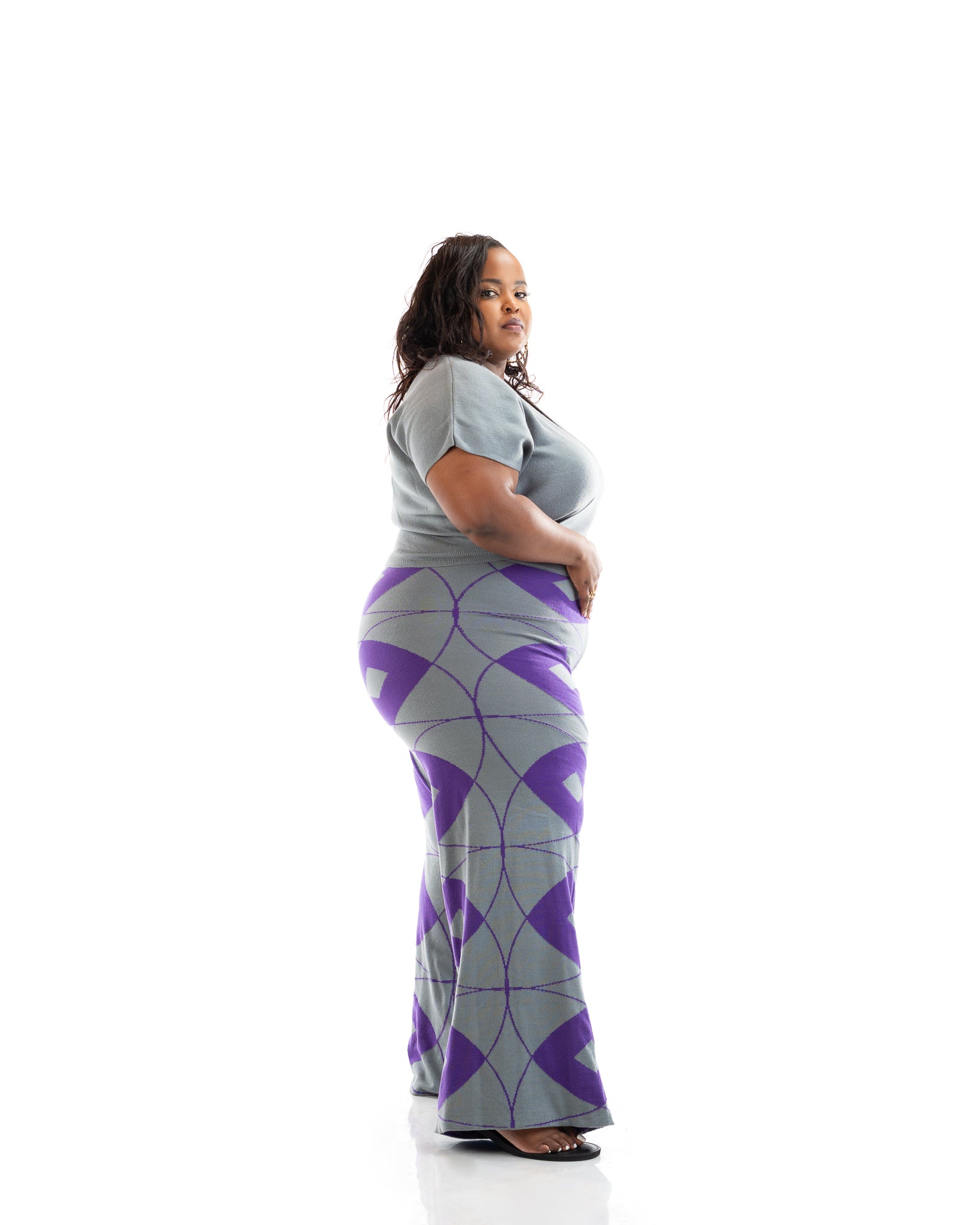 Grey and purple wide-leg knit pants made from 100% acrylic yarn, patterned women’s trousers for plus size and curvy fashion in Kenya.