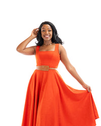 Orange sleeveless belted midi dress with square neckline and flowy skirt, women’s elegant fashion in Kenya.