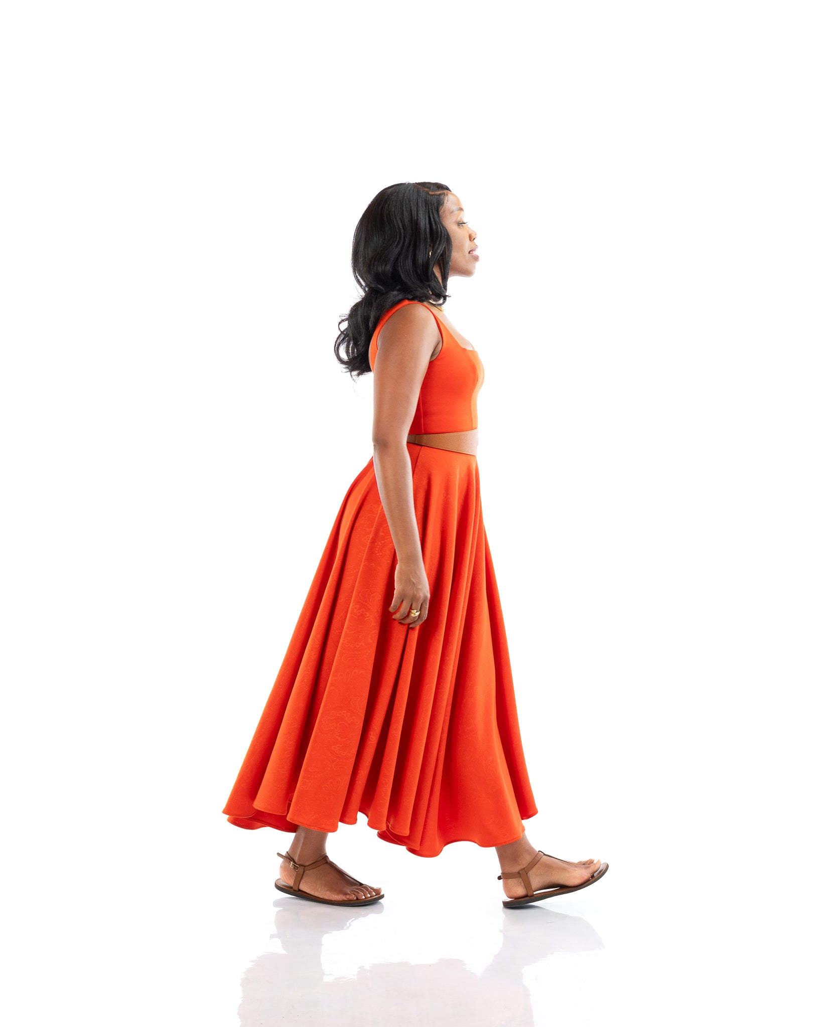 Orange sleeveless belted midi dress with square neckline and flowy skirt, women’s elegant fashion in Kenya.
