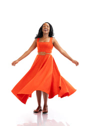Orange sleeveless belted midi dress with square neckline and flowy skirt, women’s elegant fashion in Kenya.