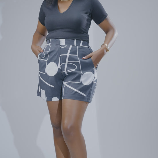 Grey and white printed high-waisted women’s shorts with geometric pattern, tailored fit, and pockets, stylish summer shorts Kenya.
