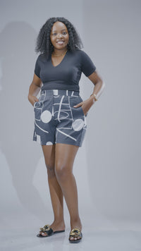 Grey and white printed high-waisted women’s shorts with geometric pattern, tailored fit, and pockets, stylish summer shorts Kenya.
