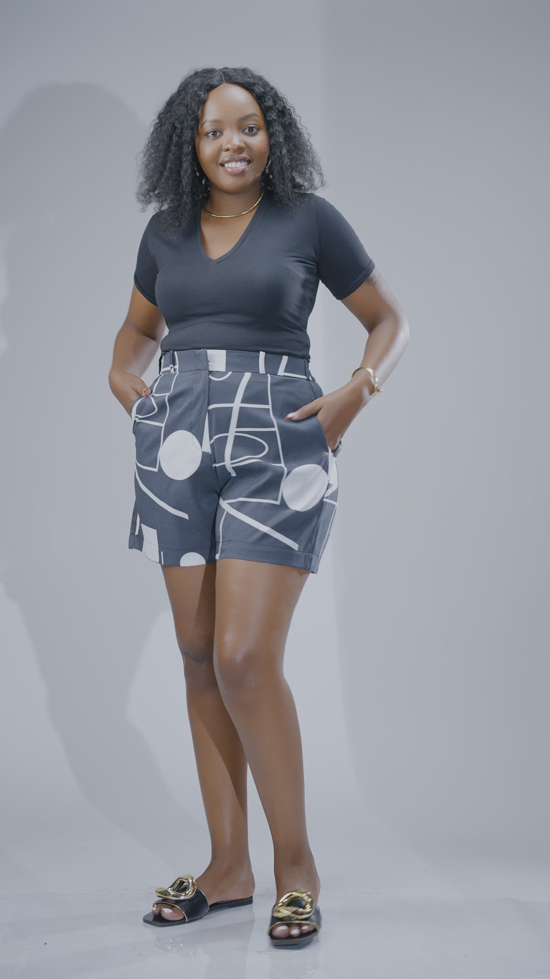 Grey and white printed high-waisted women’s shorts with geometric pattern, tailored fit, and pockets, stylish summer shorts Kenya.